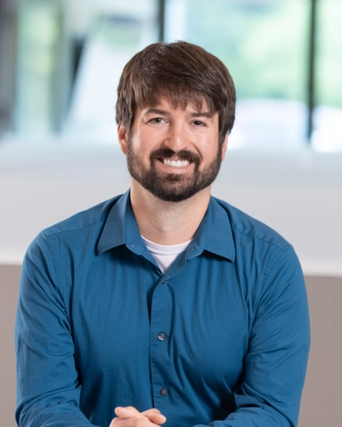 portrait of a smiling person in professional attire